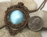 Handmade Oxidized Copper Wire Woven & Blue Fiber Optic Glass Pendant